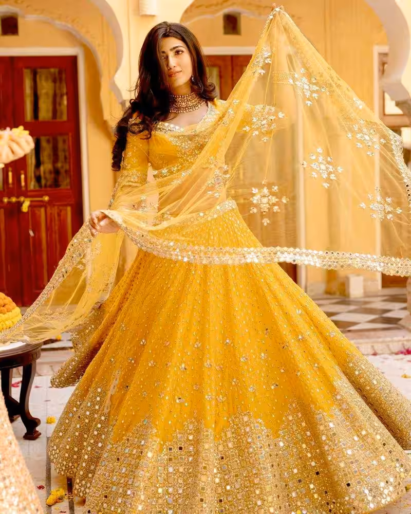 Stylish haldi yellow lehenga with mirror work