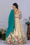 Off white kalamkari lehenga choli with teal dupatta