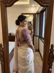 Off white wedding saree with contrast purple blouse