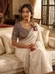 Off white wedding saree with contrast purple blouse
