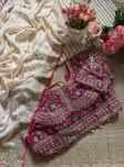Off white wedding saree with contrast purple blouse