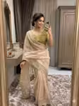 Off white wedding saree with contrast green blouse