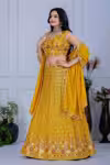 Yellow lehenga for haldi with embroidery and sequins